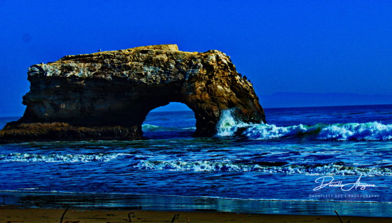 arch at the beach in california. southern california beach, ocean waves