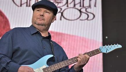 image represents Christopher cross playing guitar